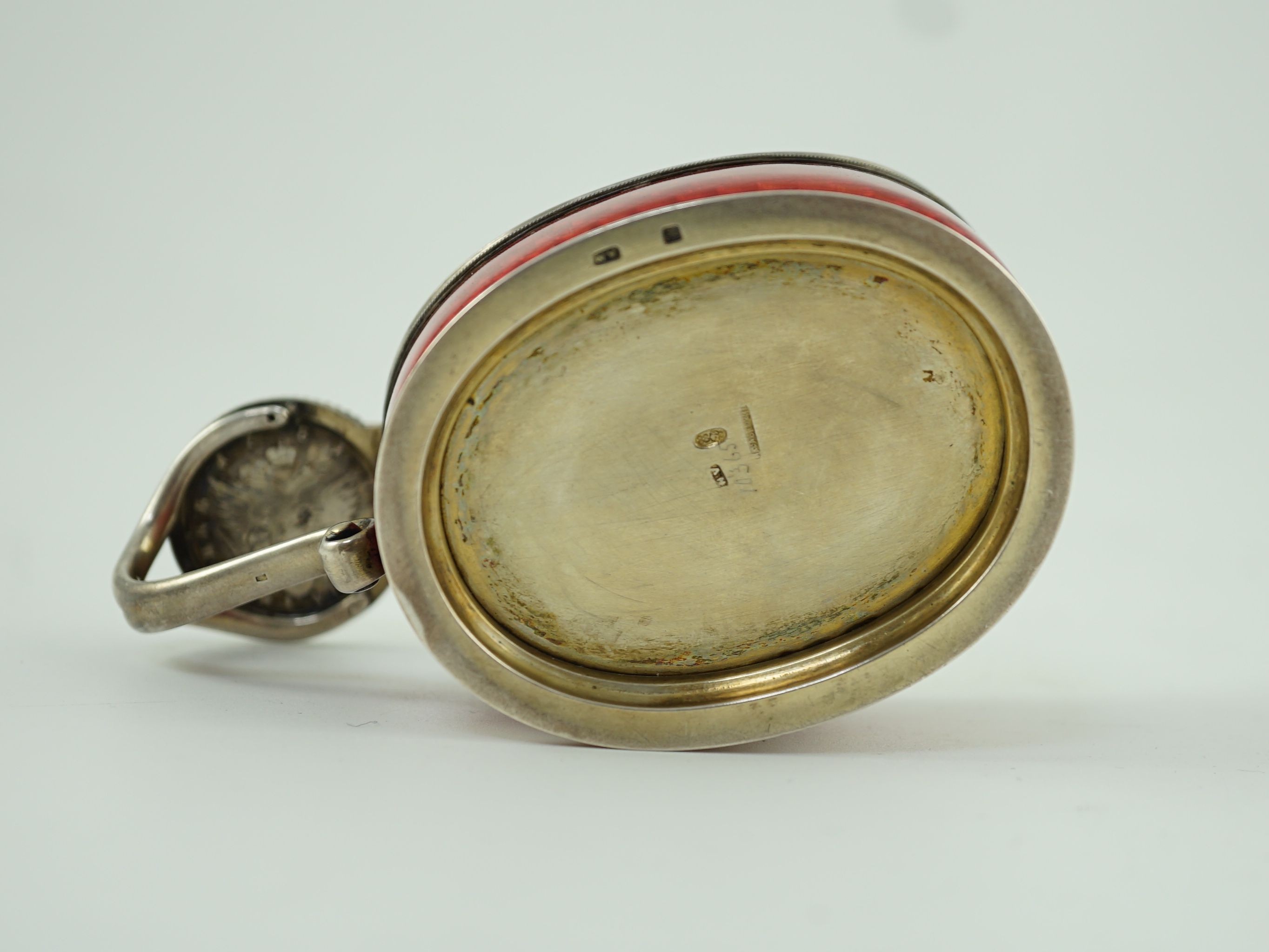 CARL FABERGE: A late 19th/early 20th century 88 zolotnik and red guilloche enamel oval kovsh, work master Anders Johan Nevalainen